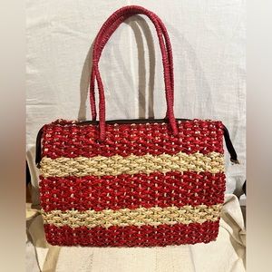 Red And Beige Hand Woven Straw Tote Bag With Zip Closure.